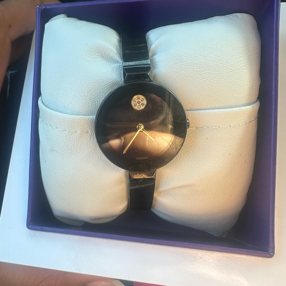 Movado Black and Gold Timepiece